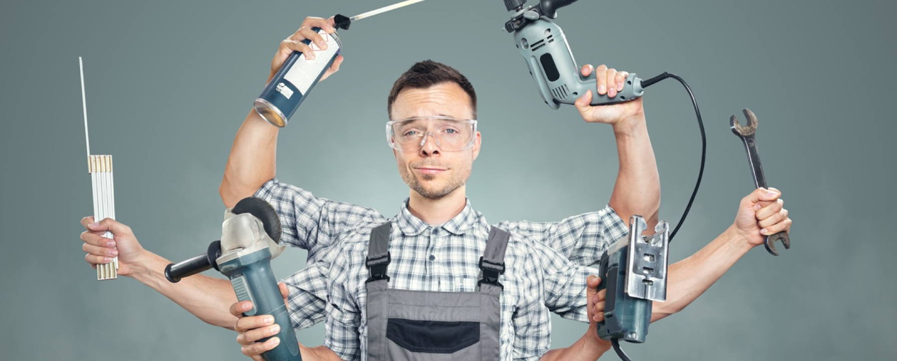 Man holding lots of tools